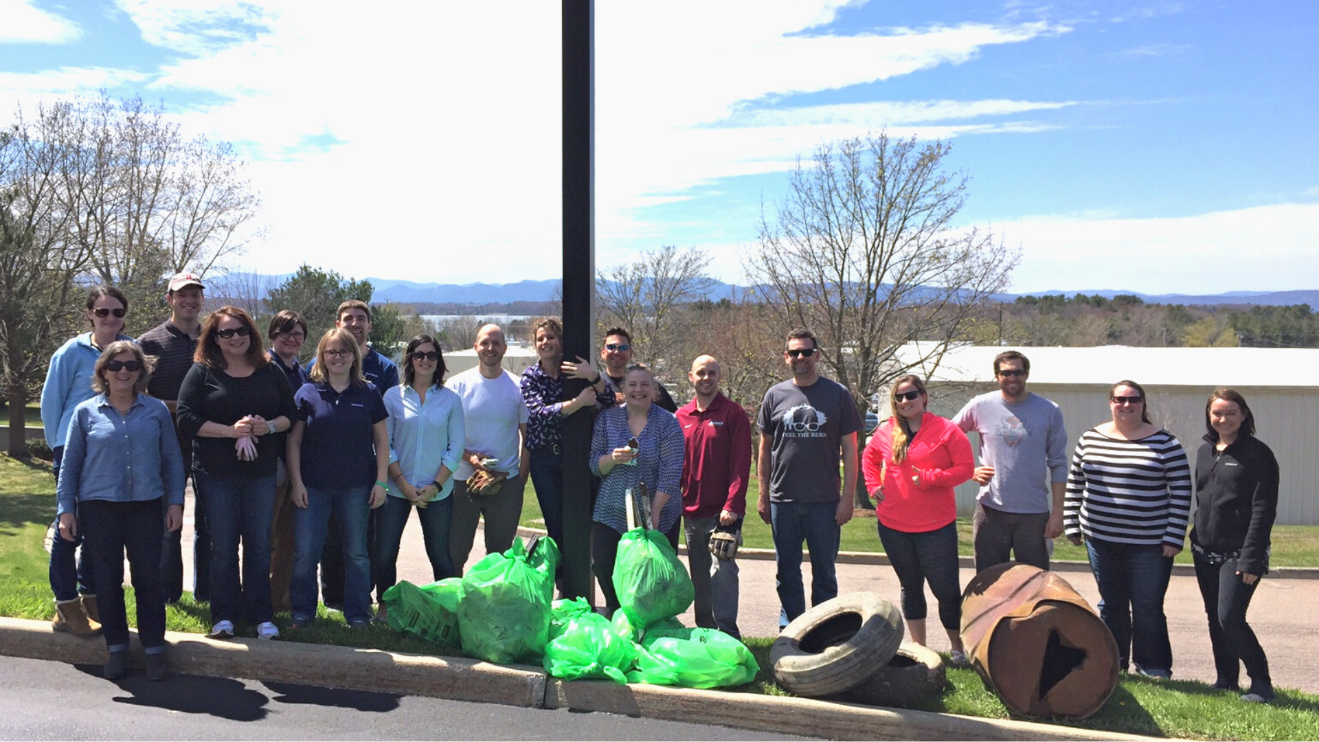 Photo of Instrumart employees posing in front of the trash they picked up for Green Up Day in 2016.