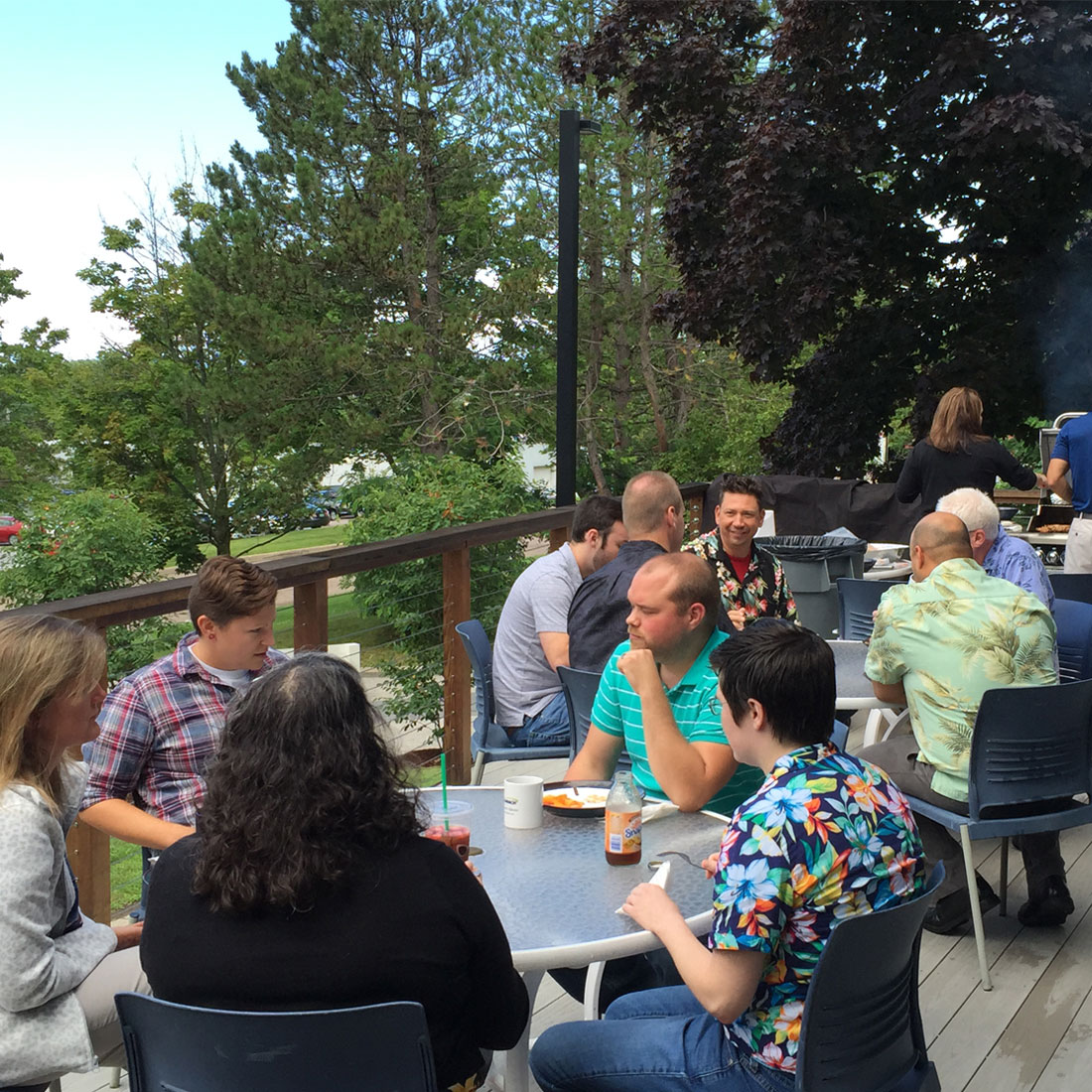 Team enjoying an outdoor BBQ